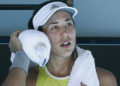 Garbine Muguruza fought back from behind in both sets to defeat racquet-smashing fourth seed Simona Halep on Thursday and set up an Australian Open final with surprise-package Sofia Kenin.