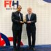 FIH President Tayyab Ikram presents IOC Honorary President Thomas Bach with the FIH Lifetime Achievement Award