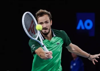 Medvedev beats heat and nerves to ease into Australian Open second round