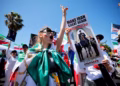 Iranians divided between support and protest as team opens World Cup campaign